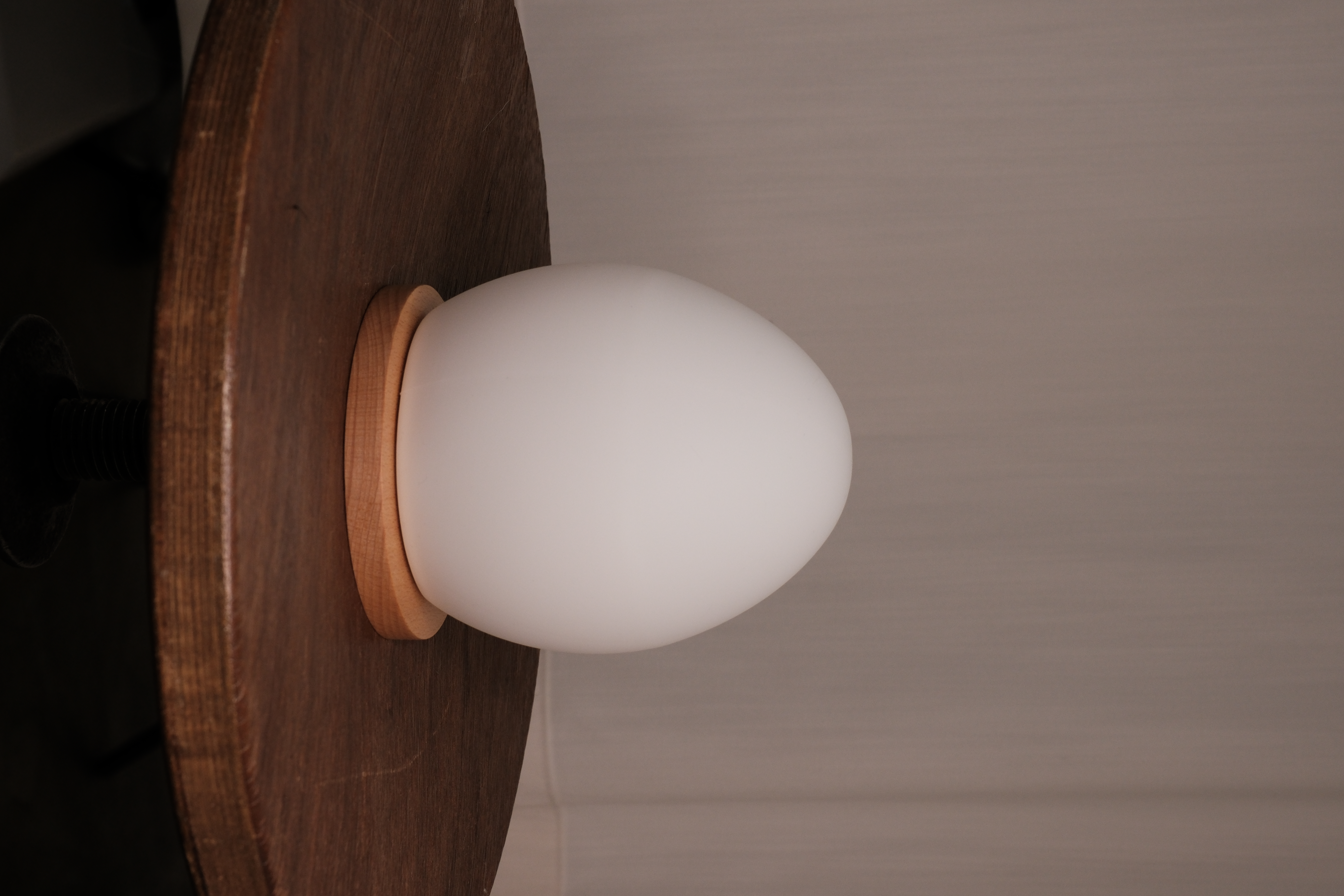 Unlit Lume on its wooden base