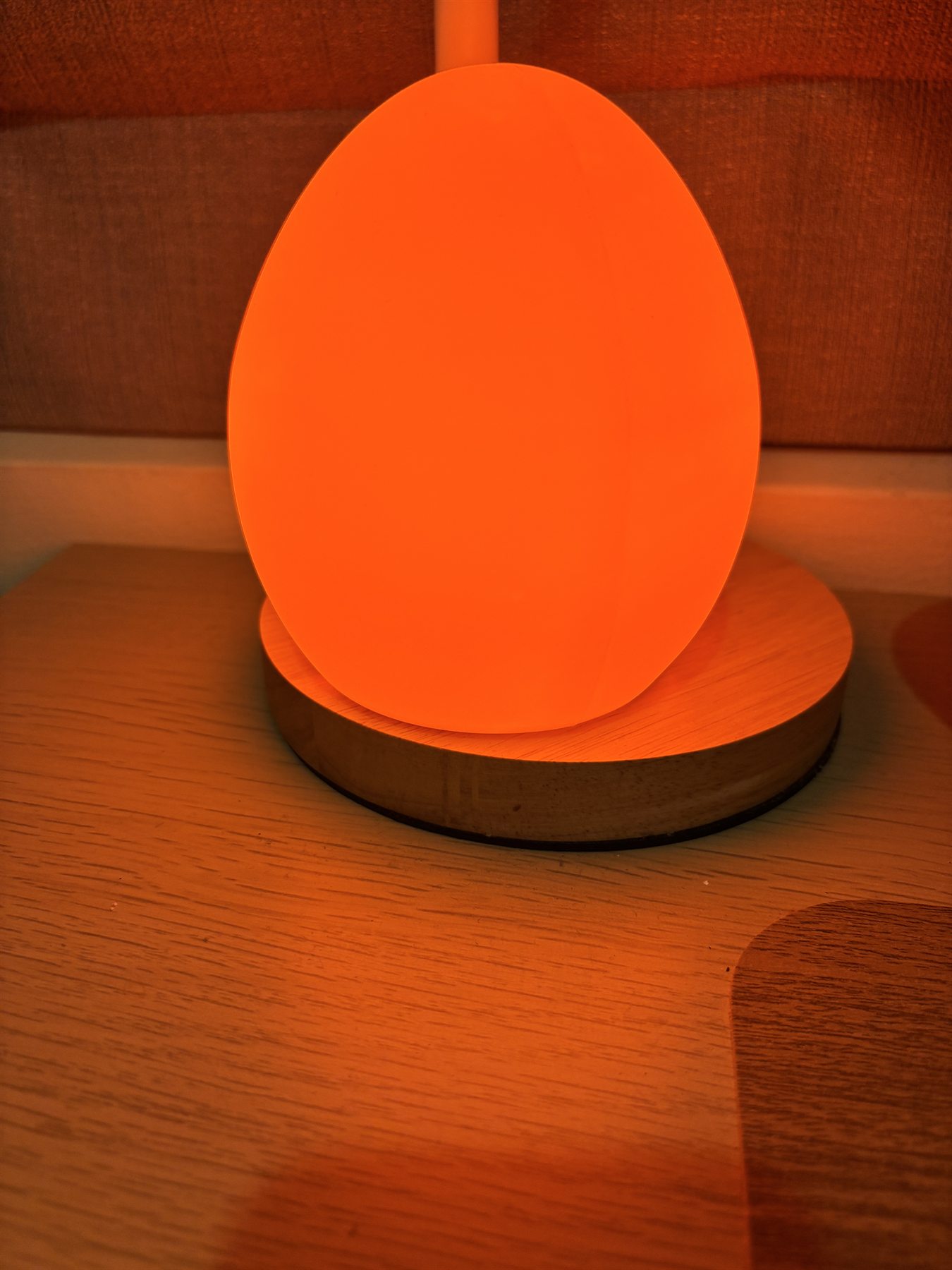 Owlnest Lume glowing with deep amber low-blue light